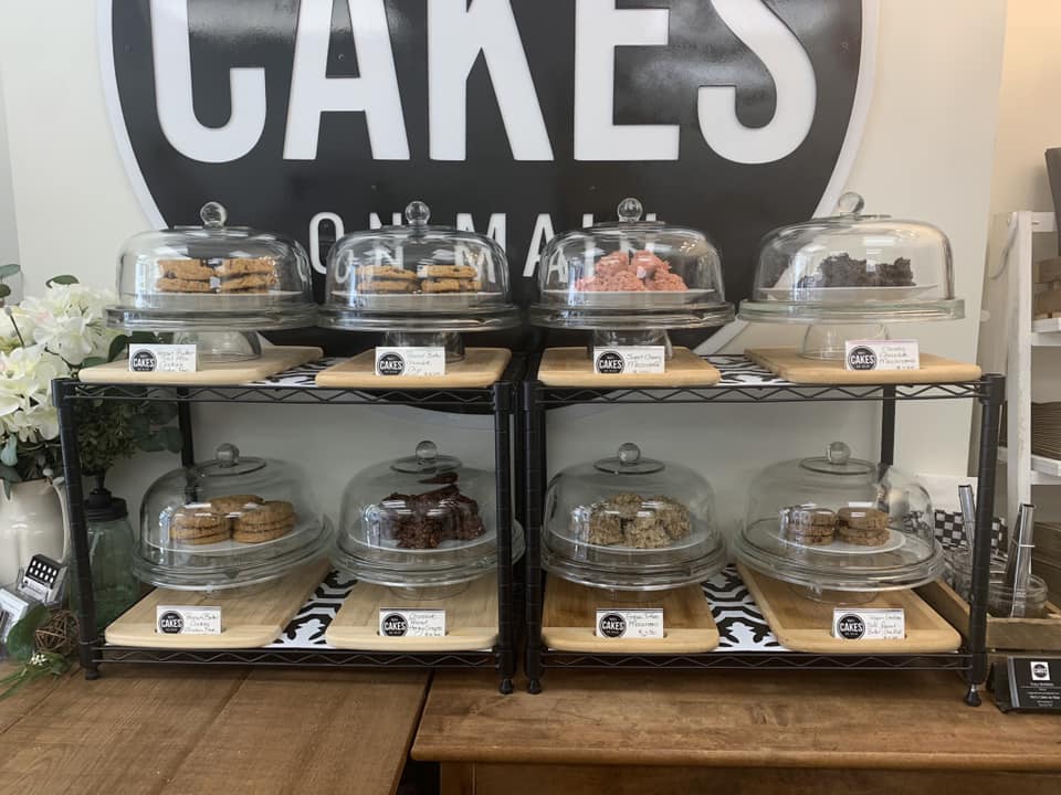Decorative cakes on display on some shelves in a store