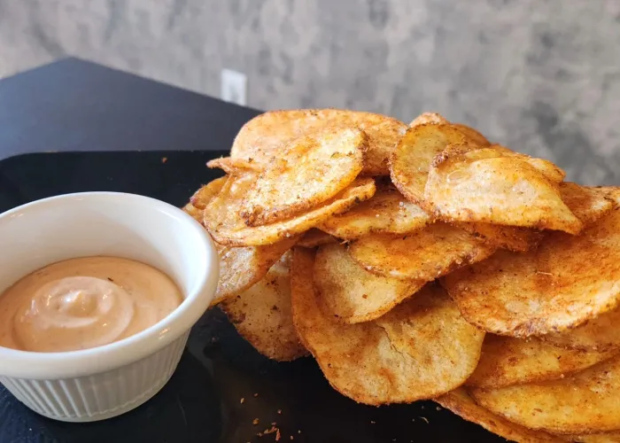 Potato Chips and dip on a plate