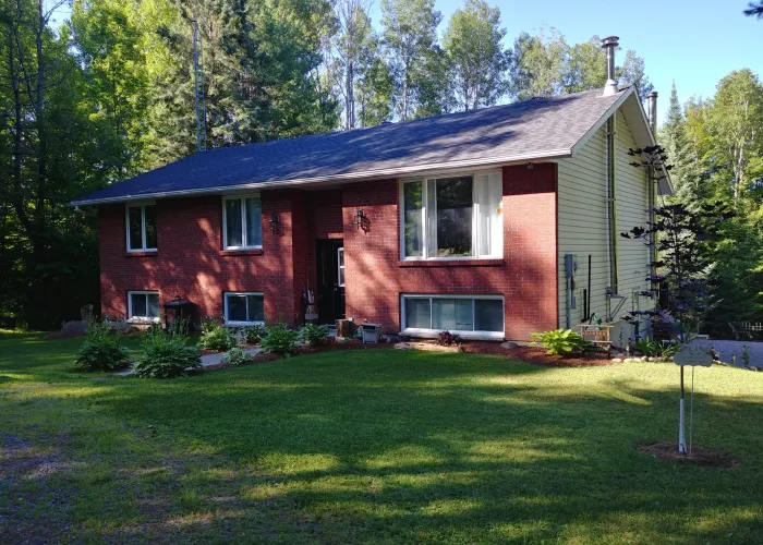 Brick Bed and Breakfast surrounded by forest in Bancroft Ontario