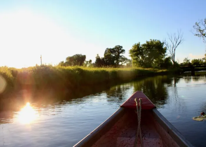 View of the bow of a canoe, from inside the canoe, on a lake